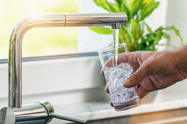 clean water being poured from a home faucet